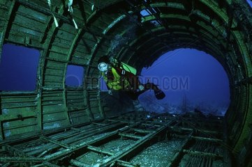Diver in plane-wreck
