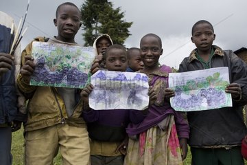 Group children showing their drawings of Gorillas Rwanda