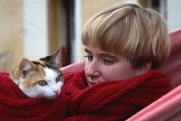 Young girl watching a cat