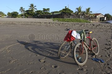 Bikes on a sand beach near a fishing village Nicaragua
