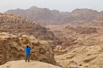 Woman observing the rocks of Petra in Jordan