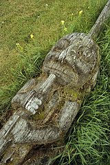 Indian Totem lying in the grass British Columbia Canada