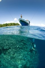 Diver and Boat above reef - Bunaken NP Indonesia