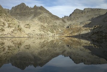 Mountain range and its reflection in Negre Lake France
