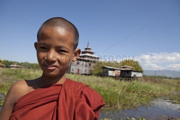 Young monk before Nyaungshwe Monastery Burma