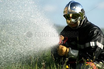 Portrait of a fireman in office in a field France