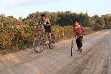 Two boys playing around Luang Prabang in Laos