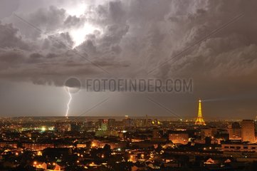 Flash on Paris and Eiffel Tower illuminated at night-France