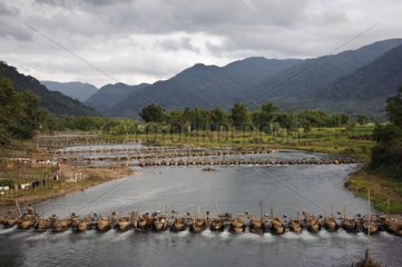 Rows of electric turbines on a river Laos