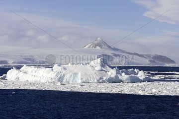 Iceberg and mountain island Antarctic Peninsula