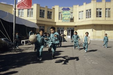 Iranian boys playing in the court of a school