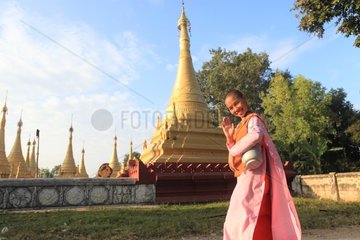 Nun walking in the village of Nyaung Shwe Burma