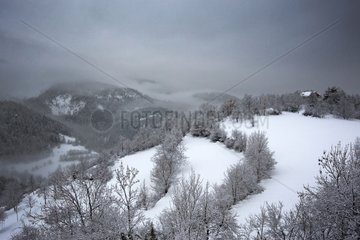 Chalet in the fog in winter Mercantour Alps France