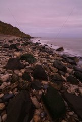 Pebbles beach at sunrise in the Calvados France