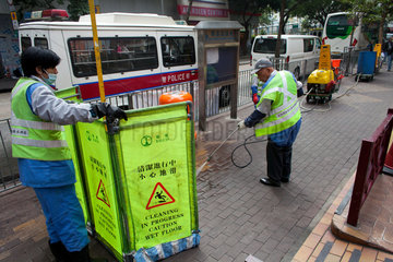 city workers cleaning sidewalk in Hongkong