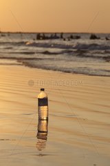 Bottled drinking water in plastic beside the sea