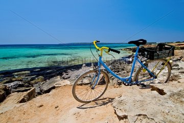Bike on rocky coast Formentera Balearic