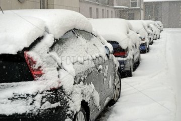 Cars under snow downtown Belfort France