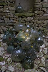 Mound of glass jars along an old wall Bourgogne