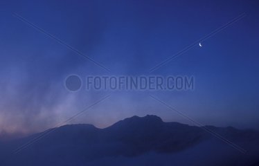 Crescent of the Moon above Auvergne at daybreak