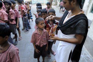 Distribution of biscuits before school for students India