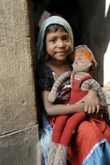 Girl sitting with a doll Calcultta India