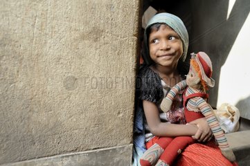 Girl sitting with a doll Calcultta India