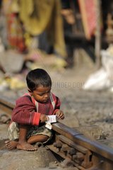 Child playing on the tracks of Calcultta India