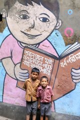 School children posing in front of a mural in Calcutta India