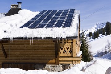 Photovoltaic cells on a cabin roof in winter