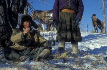 Man smoking a cigarette and drinking alcohol Mongolia