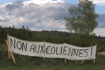 Banner denouncing the siting of wind turbines