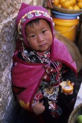 Naxi child in a market in Lijiang China