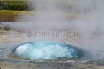 Water bubble and steam under pressure at Geysir in Iceland