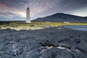 Lighthouse at the foot of a lava field volcano Snæfellsjoekull