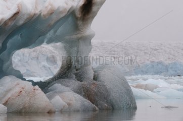 Blue ice perforated iceberg in Kronebreen Spitsbergen