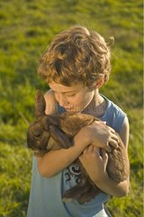 Boy holding a rabbit Holland