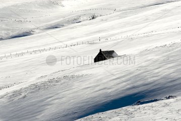 Farm in snow Cézallier Auvergne Plateau of France