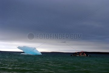 Crossing in sea kayak under a sky storm Canada