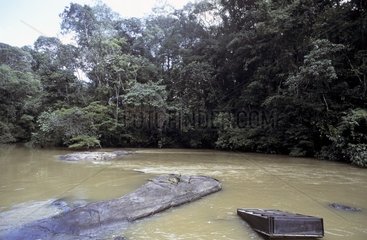 Wastes from illegal gold mining in a river French Guiana