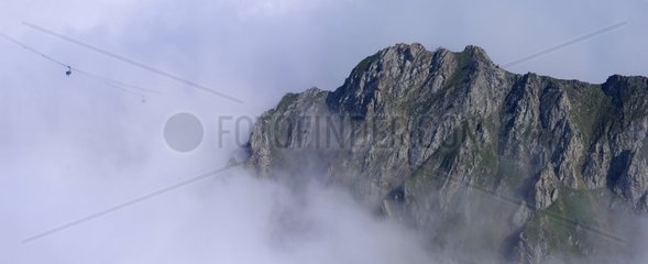 The cable of the Pic du Midi de Bigorre in the clouds