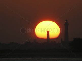 Sunset behind the lighthouse Eckmuehl Britain France