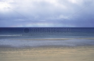 Rainbow on the horizon Omaha Beach Normandy France