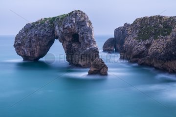 Natural arch on the Cantabrian sea Asturias Spain