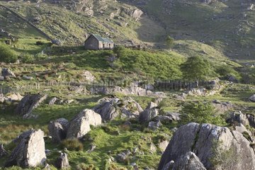 Isolated farm in mountain landscape Ireland