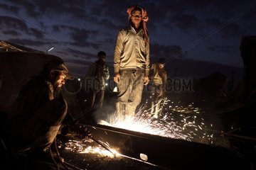 Workers on a construction site shipbreaking Bangladesh