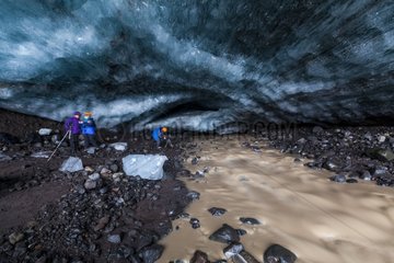 Tourists in an ice cave in the Skaftafell NP in Iceland