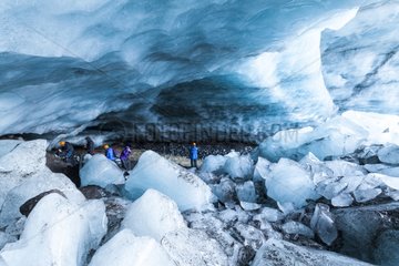 Tourists in an ice cave in the Skaftafell NP in Iceland