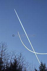 Aircraft contrails crossing the sky