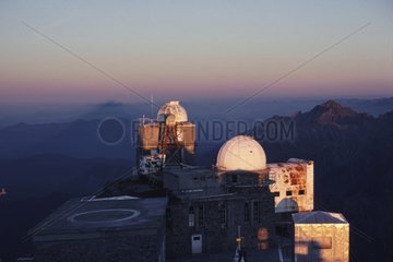 Observatoire du Pic du Midi and its shadow in the mist
